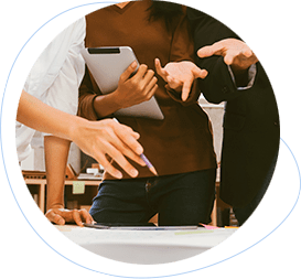 people pointing at a white table