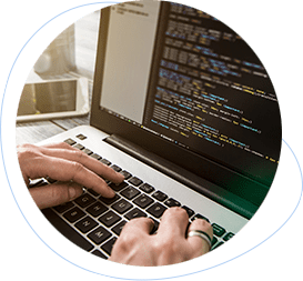 a laptop displaying custom web development code