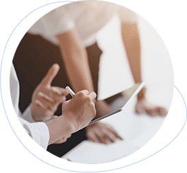 two hands next to a business person leaning on a table