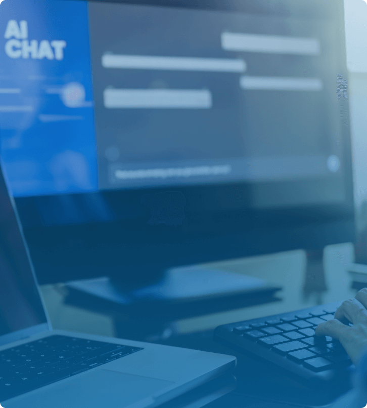 User interacting with an AI chatbot interface on desktop and laptop for SaaS automation solutions