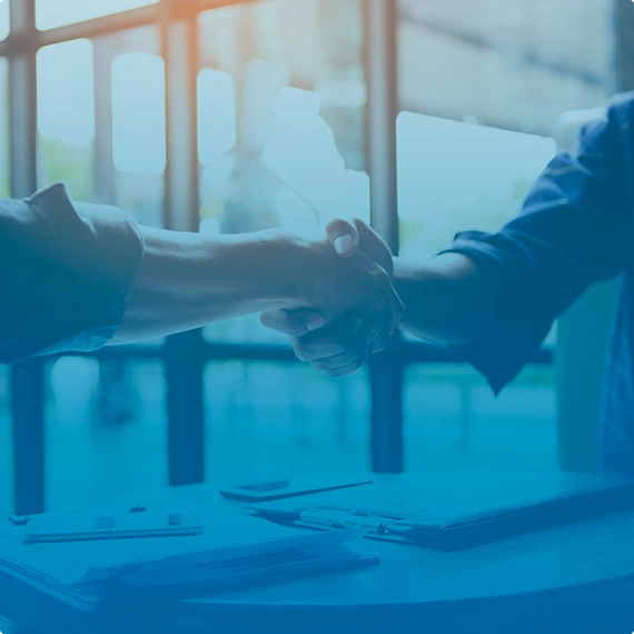 a woman with glasses doing a Google search on a laptop