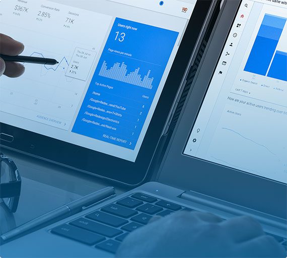 two laptops showing SEO analytics