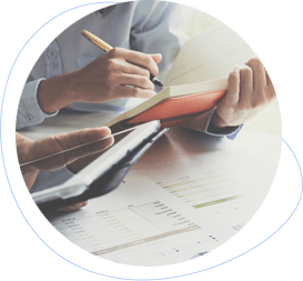 someone writing in a red notebook