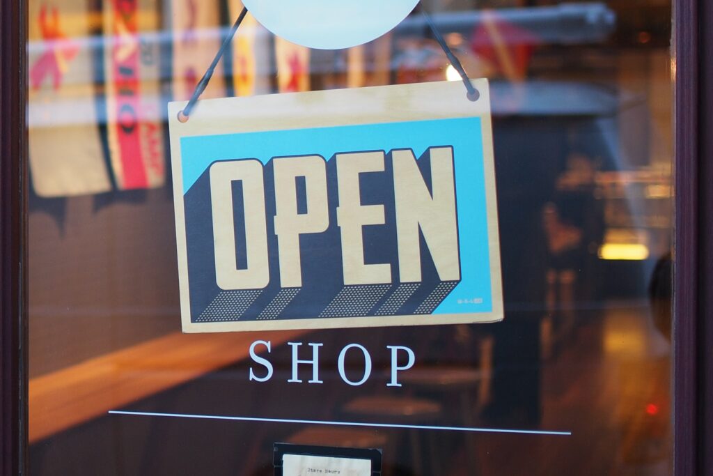blue open sign on a shop door