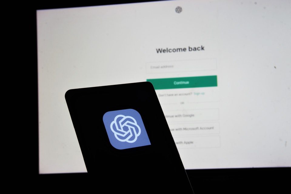 the ChatGPT logo in front of a computer screen