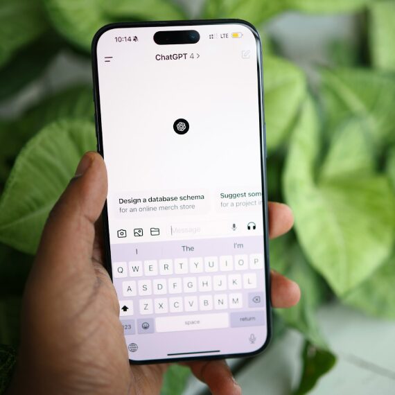 person holding a mobile phone with ChatGPT