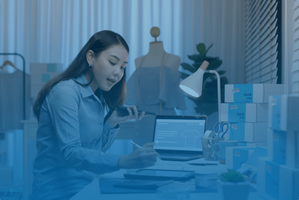 business owner with a laptop and lamp on a desk