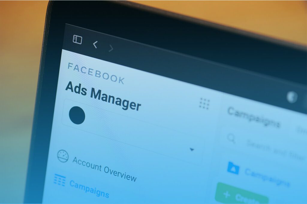 Close-up of the Facebook Ads Manager interface on a tablet showing campaign management tools