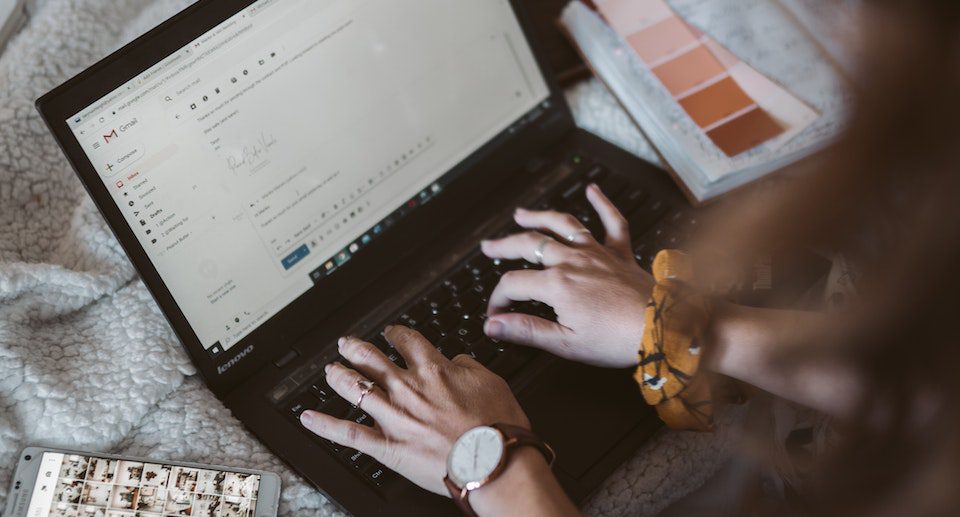 A lady sending an email