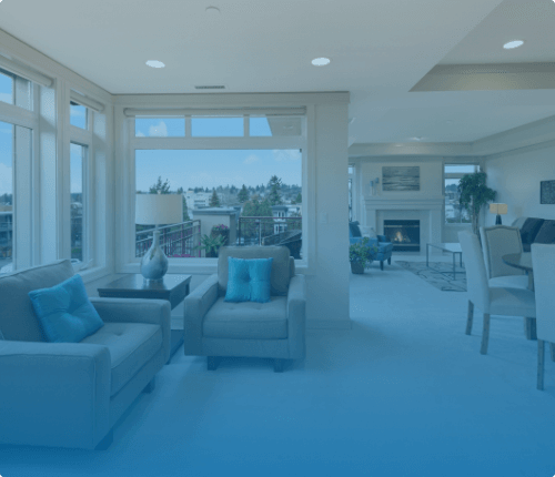 a large living room with beige furniture