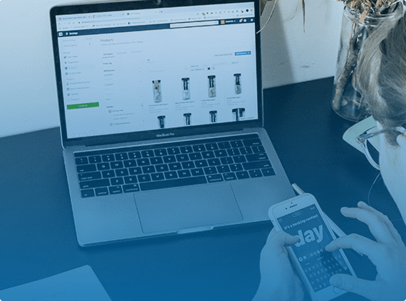 woman using a mobile phone and laptop