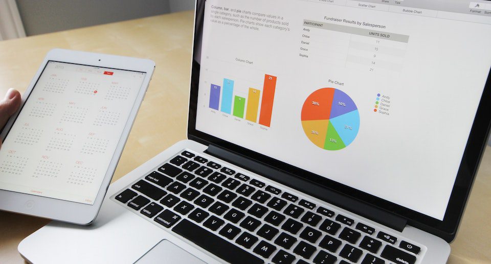 A person studying data on laptop