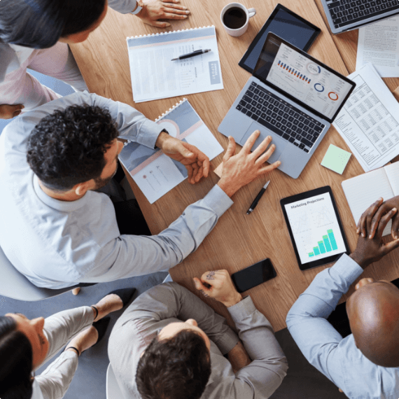 group of people working on a laptop on a table