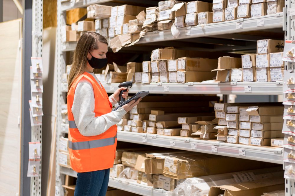 woman doing inventory in a warehouse
